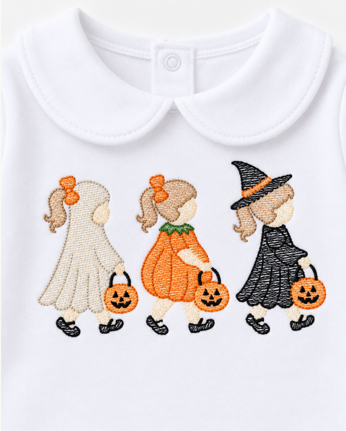 White baby bodysuit with a Peter Pan collar featuring embroidered children in ghost, pumpkin, and witch costumes holding jack-o'-lanterns.